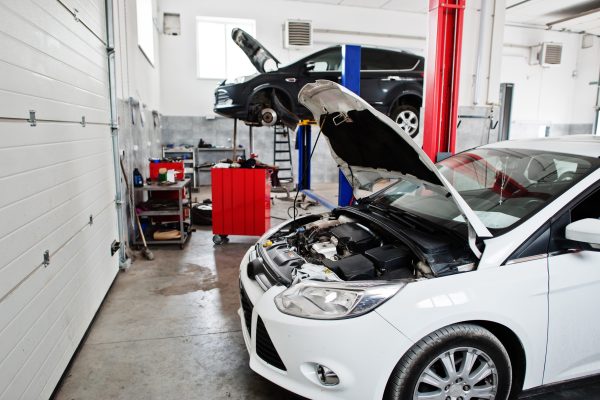 Сar in maintenance at garage service station.